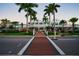 Shopping center with sidewalks and stores lined with palm trees in Venice, Florida at 5832 Semolino St, Nokomis, FL 34275