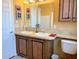 This bathroom offers a dual sink vanity and ample space for toiletries and essentials at 660 N Green Cir, Venice, FL 34285