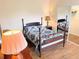 A quaint bedroom offers a comfortable bed and mirrored closet for plenty of storage at 660 N Green Cir, Venice, FL 34285