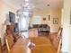 Cozy living room featuring hardwood floors, natural light, modern lighting, and an open floor plan at 660 N Green Cir, Venice, FL 34285