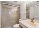 Bathroom featuring stone floor shower with glass door and modern sink at 6800 Placida Rd # 280, Englewood, FL 34224