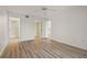 Bright bedroom with wood floors, multiple closets, and ensuite bathroom at 6800 Placida Rd # 280, Englewood, FL 34224