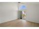 Bedroom features vaulted ceiling with fan and sliding glass door to patio at 6800 Placida Rd # 280, Englewood, FL 34224