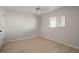 Bedroom with light colored wood floors, light walls, and a window at 6800 Placida Rd # 280, Englewood, FL 34224