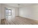 Light and airy bedroom featuring wood floors and a private balcony at 6800 Placida Rd # 280, Englewood, FL 34224