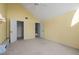 Bedroom with walk in closet and bright yellow walls at 6800 Placida Rd # 280, Englewood, FL 34224