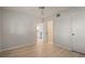 Bright bedroom features light wood floors, ceiling fan and closet at 6800 Placida Rd # 280, Englewood, FL 34224