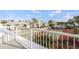 Balcony view of community with well-maintained tennis courts and beautiful residential buildings in the background at 6800 Placida Rd # 280, Englewood, FL 34224