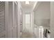 Bright hallway with carpet floors and white doors at 6800 Placida Rd # 280, Englewood, FL 34224