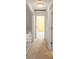 Hallway on second floor with carpet floors and white doors at 6800 Placida Rd # 280, Englewood, FL 34224