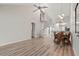 Open living room with a modern fan, and spiral staircase leading to the second floor at 6800 Placida Rd # 280, Englewood, FL 34224