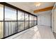 Bright sunroom features tile flooring and large windows with lovely outdoor views at 6800 Placida Rd # 280, Englewood, FL 34224
