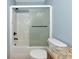 Bathroom features glass enclosed shower, white tiles and modern fixtures at 6964 Glacier Ave, North Port, FL 34291