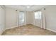 Bedroom showcasing tile floors, a ceiling fan, and natural light from windows with sheer curtains at 6964 Glacier Ave, North Port, FL 34291