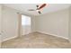 Bedroom with neutral paint, tile flooring, a ceiling fan and a window with sheers at 6964 Glacier Ave, North Port, FL 34291