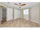 Bedroom featuring neutral paint, tile flooring, closet and window with sheers at 6964 Glacier Ave, North Port, FL 34291