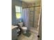 Nicely appointed bathroom with tiled shower, and a convenient built-in toiletry niche at 700 Forest St, Nokomis, FL 34275