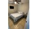 Bedroom with plush bedding, TV, side tables and lamps at 700 Forest St, Nokomis, FL 34275