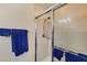 Bathroom featuring glass shower and towel rack at 700 Gardens Edge Dr # 722, Venice, FL 34285
