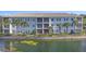 Charming three-story building with manicured landscaping and scenic water view at 700 Gardens Edge Dr # 722, Venice, FL 34285