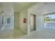 Well-lit hallway with an elevator and access to residences at 700 Gardens Edge Dr # 722, Venice, FL 34285