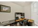 Functional home office space featuring built-in desk, storage, and natural light from a window at 700 Gardens Edge Dr # 722, Venice, FL 34285