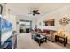 Inviting living area with an open floor plan and sliding doors to an outdoor patio at 700 Gardens Edge Dr # 722, Venice, FL 34285
