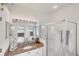 Bathroom featuring granite counters, dual sinks, a shower, and a relaxing tub at 809 Derbyshire Dr, Venice, FL 34285