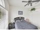 Bedroom with a window, ceiling fan and closet at 809 Derbyshire Dr, Venice, FL 34285