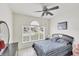 Bedroom with a window, tiled floor and ceiling fan at 809 Derbyshire Dr, Venice, FL 34285