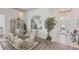 The dining area has a chandelier, decor, and views to the foyer, making for an inviting space at 809 Derbyshire Dr, Venice, FL 34285
