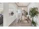 Formal dining room with chandelier, rug, and views of the kitchen, ideal for Gathering meals at 809 Derbyshire Dr, Venice, FL 34285