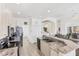 Bright kitchen with granite counters, stainless appliances, and open design in The Plantation community, Venice, Florida at 809 Derbyshire Dr, Venice, FL 34285