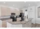 Well-equipped kitchen featuring granite countertops and modern appliances in The Plantation community, Venice, Florida at 809 Derbyshire Dr, Venice, FL 34285