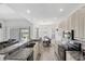 Open-concept kitchen area with stainless steel appliances, granite countertops, and seamless integration with the living space at 809 Derbyshire Dr, Venice, FL 34285