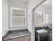 Laundry room featuring front loading appliances and storage space at 809 Derbyshire Dr, Venice, FL 34285