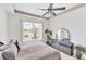 Primary bedroom featuring a ceiling fan and water view, with peaceful and serene vibes at 809 Derbyshire Dr, Venice, FL 34285