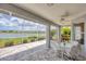 Spacious patio with beautiful views of the lake and landscaping at 809 Derbyshire Dr, Venice, FL 34285