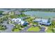 Aerial view of community amenities, pool, and lake at 8245 Grande Shores Dr, Sarasota, FL 34240