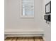 Light entryway with built in bench, hardwood floors, and lots of light at 8245 Grande Shores Dr, Sarasota, FL 34240