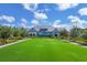 Exterior of community center building with pristine grounds and lawn at 8245 Grande Shores Dr, Sarasota, FL 34240