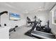 Home gym features varied exercise machines, a ceiling fan, and recessed lighting at 8245 Grande Shores Dr, Sarasota, FL 34240