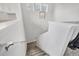 Stairway with carpeted steps and white railing at 8245 Grande Shores Dr, Sarasota, FL 34240