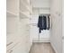 A walk-in closet with custom shelving and ample storage space at 8245 Grande Shores Dr, Sarasota, FL 34240