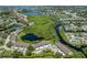 Beautiful aerial view of the community showcasing lush landscaping, waterways, and nearby amenities at 841 Waterside Dr # 202, Venice, FL 34285