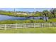 Aerial view of waterfront property with mature landscaping, a private dock, and a well-maintained home at 841 Waterside Dr # 202, Venice, FL 34285