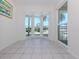 Bright breakfast nook features tile flooring, neutral paint and lots of windows at 841 Waterside Dr # 202, Venice, FL 34285
