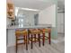 Bright kitchen features counter with barstool seating and open floorplan at 841 Waterside Dr # 202, Venice, FL 34285