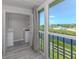 Laundry with a washer, dryer, storage and great outside views at 841 Waterside Dr # 202, Venice, FL 34285