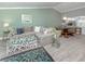 Comfortable living room with kitchen view, featuring a large sofa, stylish decor, and ample space at 841 Waterside Dr # 202, Venice, FL 34285